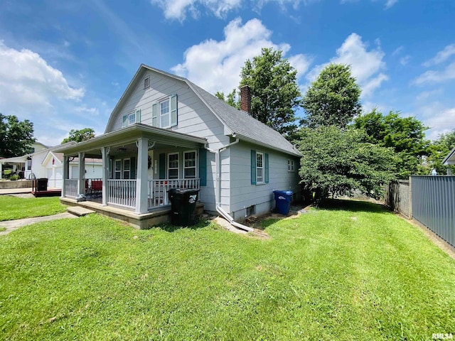 245 W Mcclernand Ave, Shawneetown, IL 62984 - view of side of home with a porch, roof with shingles, a chimney, and a gambrel roof