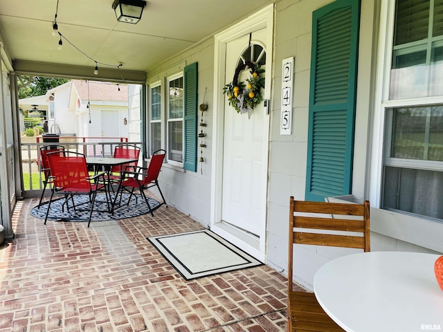245 W Mcclernand Ave, Shawneetown, IL 62984 - covered porch featuring outdoor dining area