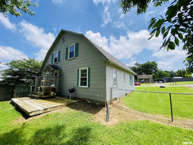 245 W Mcclernand Ave, Shawneetown, IL 62984 - view of home's exterior featuring a wooden deck and roof with shingles
