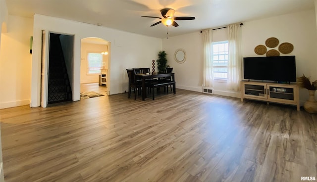 245 W Mcclernand Ave, Shawneetown, IL 62984 - living room featuring arched walkways, ceiling fan, and wood finished floors