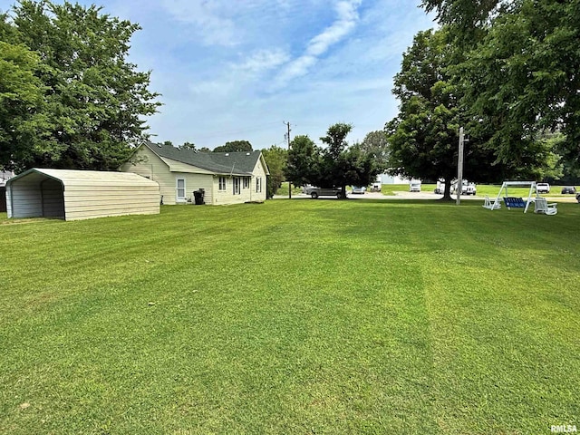 104 E 5th St, Brookport, IL 62910 - view of grassy yard featuring a carport