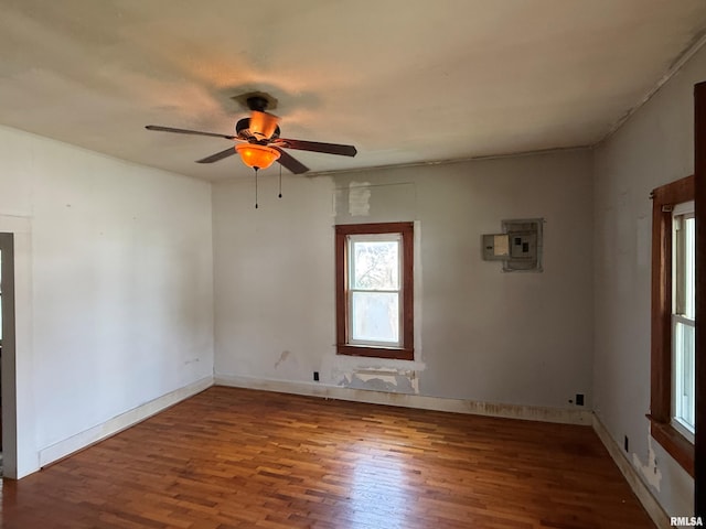 104 E 5th St, Brookport, IL 62910 - spare room with wood finished floors, electric panel, and ceiling fan