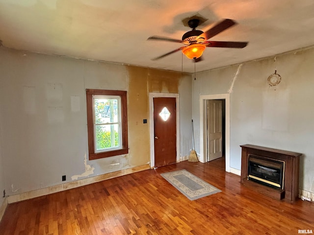 104 E 5th St, Brookport, IL 62910 - entryway featuring wood finished floors, ceiling fan, and a glass covered fireplace