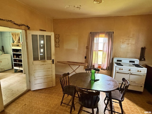 104 E 5th St, Brookport, IL 62910 - dining room with washer / dryer and tile patterned floors