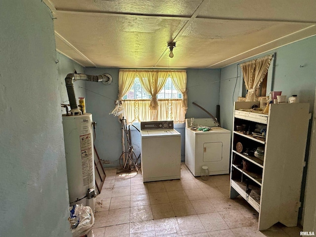 104 E 5th St, Brookport, IL 62910 - laundry room featuring gas water heater, washing machine and clothes dryer, a textured ceiling, and a textured wall