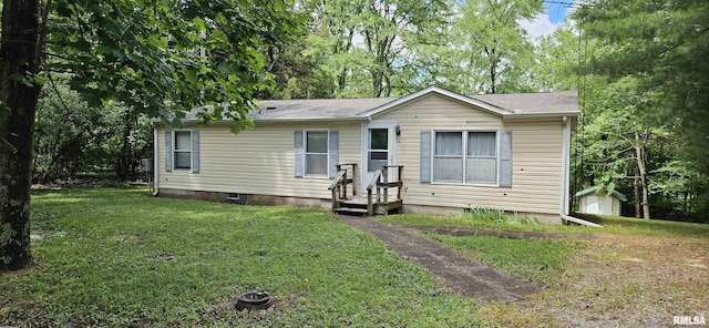 45 Donetta Ln, Creal Springs, IL 62922 - manufactured / mobile home featuring crawl space, a front lawn, and a storage unit
