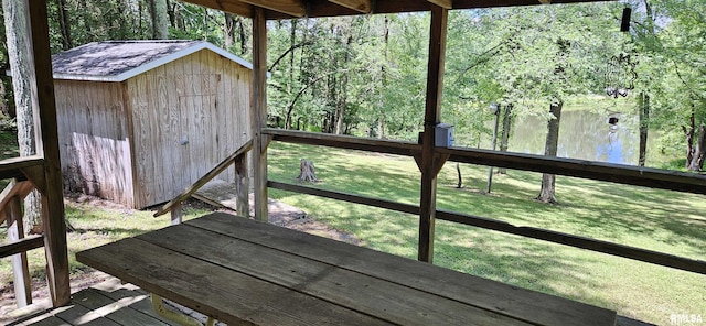 45 Donetta Ln, Creal Springs, IL 62922 - deck featuring a water view, a storage unit, and a lawn