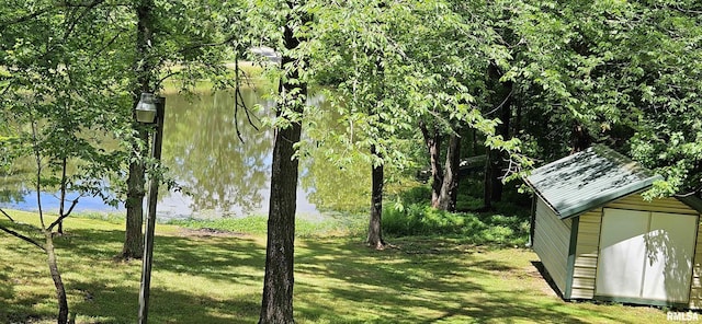 45 Donetta Ln, Creal Springs, IL 62922 - view of green lawn featuring a storage shed and a water view