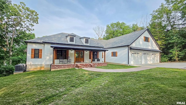 2940 Parrish Rdg, Goreville, IL 62939 - modern farmhouse featuring covered porch, a front lawn, driveway, and french doors