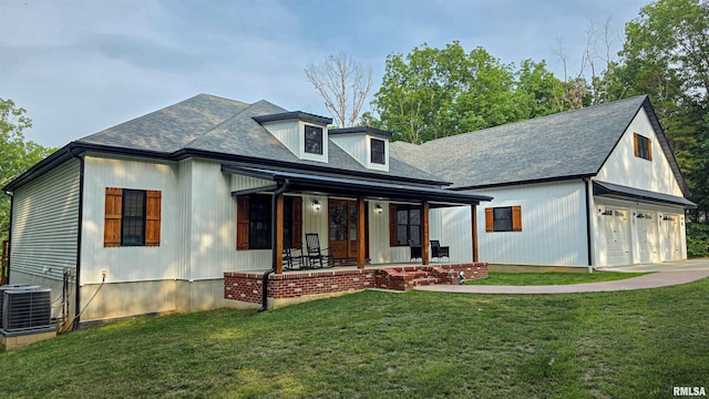 2940 Parrish Rdg, Goreville, IL 62939 - modern farmhouse with a porch, a front yard, a garage, roof with shingles, and driveway