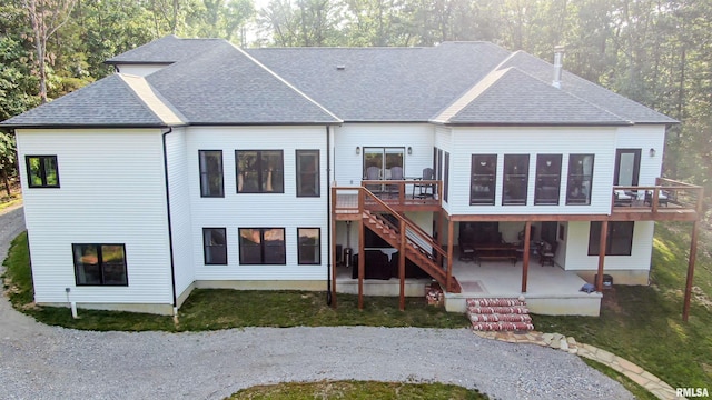 2940 Parrish Rdg, Goreville, IL 62939 - back of property featuring a deck, a patio area, roof with shingles, and stairway