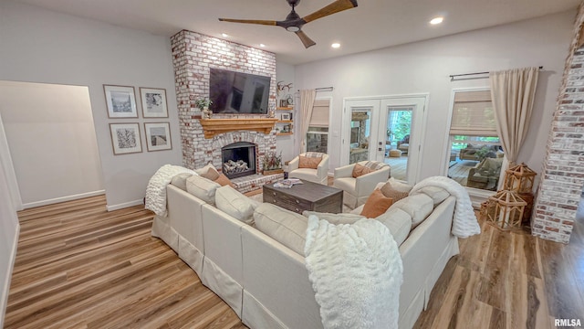 2940 Parrish Rdg, Goreville, IL 62939 - living area with a ceiling fan, a brick fireplace, wood finished floors, recessed lighting, and french doors