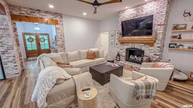 2940 Parrish Rdg, Goreville, IL 62939 - living area featuring wood finished floors, ceiling fan, a fireplace, french doors, and recessed lighting