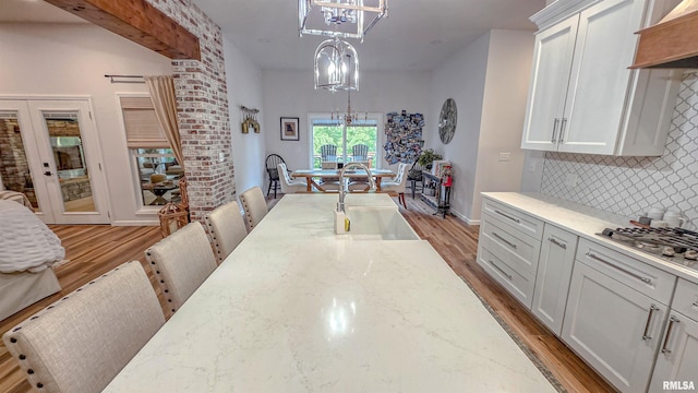 2940 Parrish Rdg, Goreville, IL 62939 - dining room featuring a chandelier, light wood-type flooring, and french doors