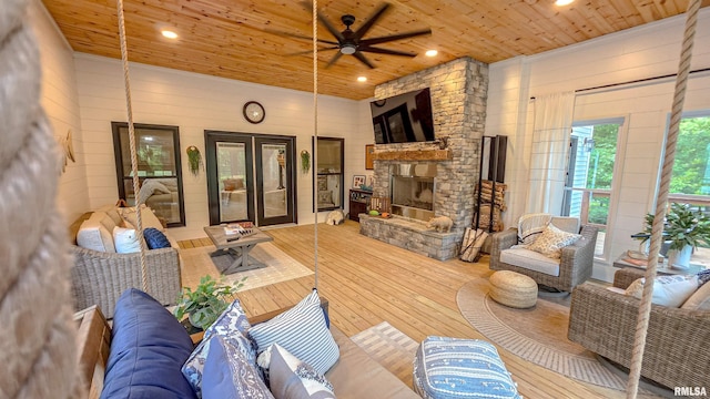 2940 Parrish Rdg, Goreville, IL 62939 - living area featuring wood ceiling, hardwood / wood-style floors, ceiling fan, wooden walls, and french doors