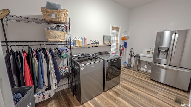 2940 Parrish Rdg, Goreville, IL 62939 - laundry area with washer and clothes dryer and wood finished floors