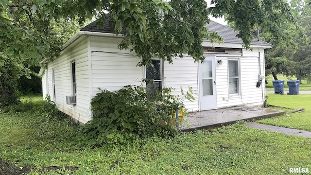 404 E Main St, Buckner, IL 62812 - view of side of home featuring a lawn and cooling unit