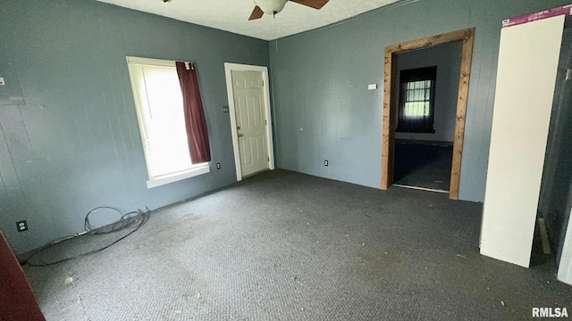 404 E Main St, Buckner, IL 62812 - unfurnished bedroom featuring carpet and ceiling fan