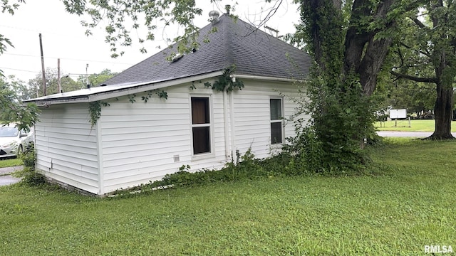 404 E Main St, Buckner, IL 62812 - view of property exterior with a shingled roof and a yard