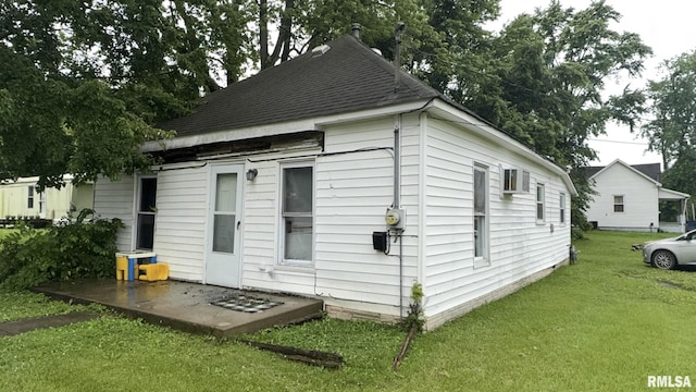 404 E Main St, Buckner, IL 62812 - view of side of property with a lawn and roof with shingles