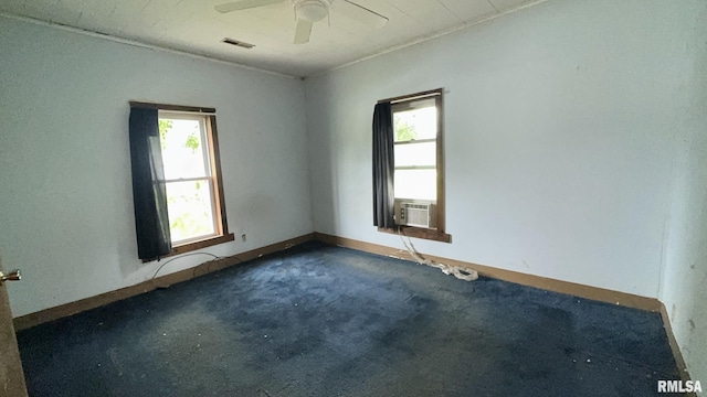 404 E Main St, Buckner, IL 62812 - spare room featuring healthy amount of natural light, a ceiling fan, carpet flooring, and cooling unit