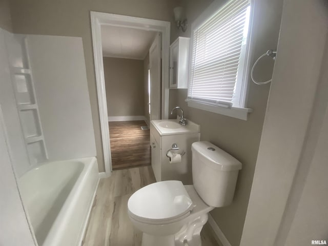 211 Charles St, Benton, IL 62812 - bathroom featuring vanity, wood finished floors, and shower / washtub combination