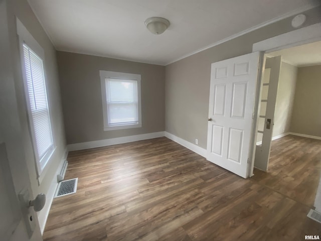 211 Charles St, Benton, IL 62812 - empty room featuring ornamental molding and dark wood finished floors
