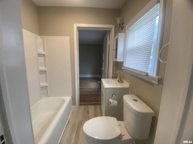 211 Charles St, Benton, IL 62812 - full bath with vanity, wood finished floors, and shower / washtub combination