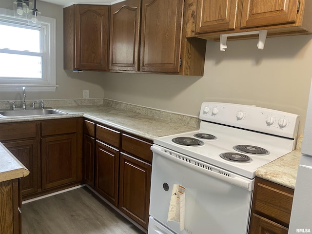 211 Charles St, Benton, IL 62812 - kitchen featuring white electric range oven, light countertops, and wood finished floors