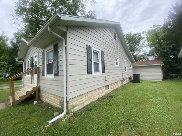 211 Charles St, Benton, IL 62812 - view of side of home featuring a central AC unit and a yard