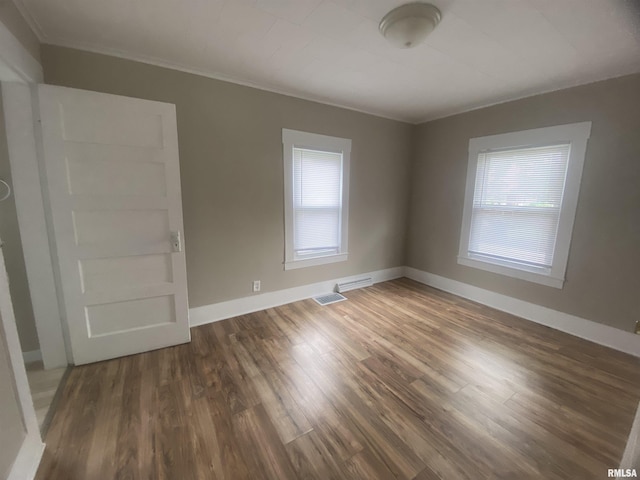 211 Charles St, Benton, IL 62812 - spare room featuring healthy amount of natural light, wood finished floors, and crown molding