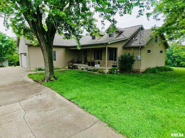2209 Cedar Hill Rd, West Frankfort, IL 62896 - view of front facade featuring a porch, driveway, a front lawn, and a shingled roof