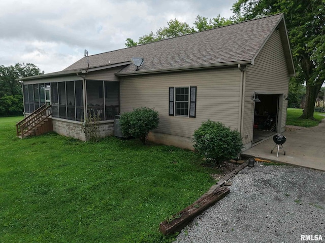 2209 Cedar Hill Rd, West Frankfort, IL 62896 - rear view of property with an attached garage, a sunroom, gravel driveway, and roof with shingles