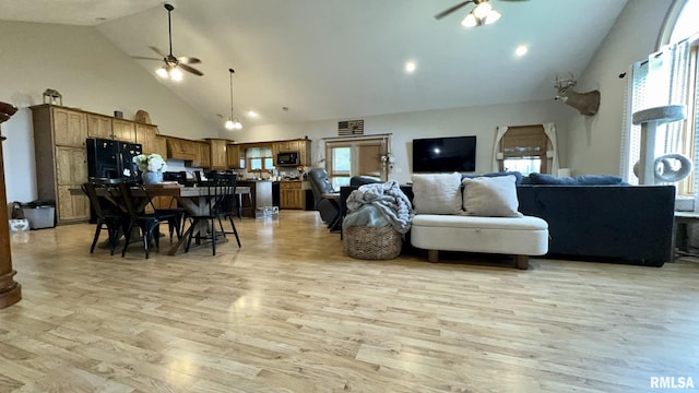 2209 Cedar Hill Rd, West Frankfort, IL 62896 - living area featuring a ceiling fan, high vaulted ceiling, and light wood finished floors