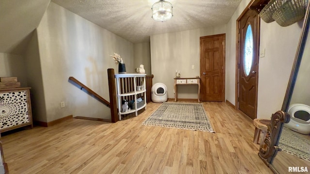 2209 Cedar Hill Rd, West Frankfort, IL 62896 - entrance foyer with wood finished floors, a chandelier, and a textured ceiling