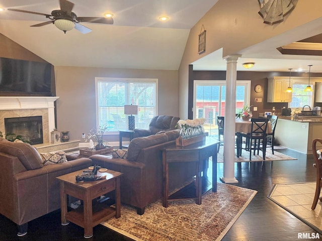 5024 Rosebud Rd, Metropolis, IL 62960 - living room with ornate columns, lofted ceiling, ceiling fan, wood finished floors, and a premium fireplace