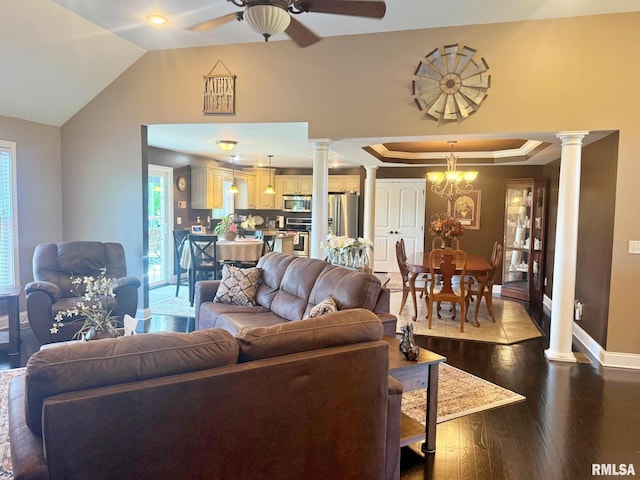 5024 Rosebud Rd, Metropolis, IL 62960 - living room with ornate columns, a ceiling fan, dark wood finished floors, lofted ceiling, and a raised ceiling