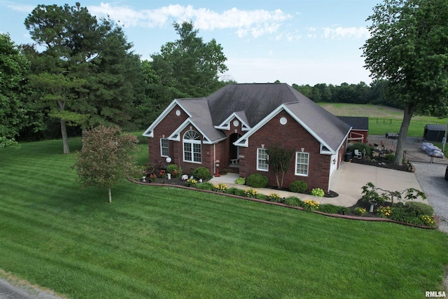 5024 Rosebud Rd, Metropolis, IL 62960 - view of front facade with brick siding, a front lawn, and driveway