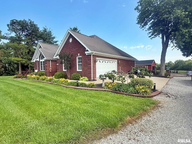 5024 Rosebud Rd, Metropolis, IL 62960 - view of side of home with brick siding, an attached garage, and driveway