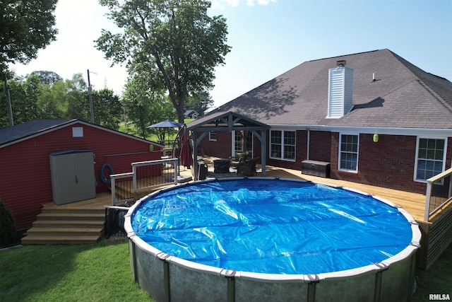 5024 Rosebud Rd, Metropolis, IL 62960 - view of swimming pool featuring a deck and an outbuilding