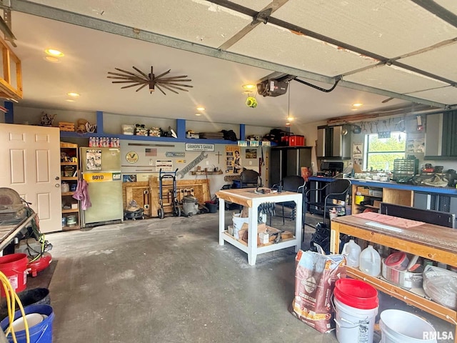5024 Rosebud Rd, Metropolis, IL 62960 - garage featuring a workshop area, a garage door opener, and recessed lighting