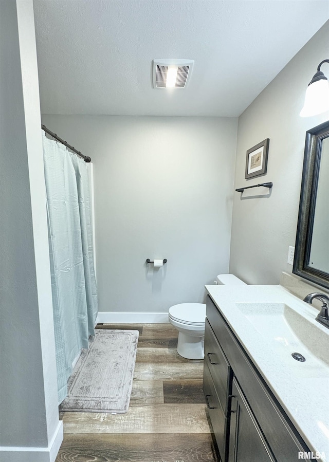 408 Madison St, Cambria, IL 62915 - bathroom featuring vanity, wood finished floors, and a shower with curtain