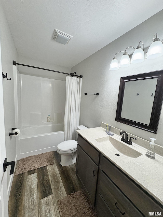408 Madison St, Cambria, IL 62915 - full bath featuring wood finished floors, vanity, and shower / bath combo