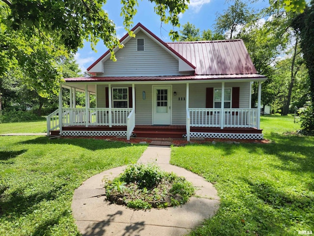 111 Bevard St, Carterville, IL 62918 - farmhouse-style home featuring covered porch, a front yard, and a metal roof