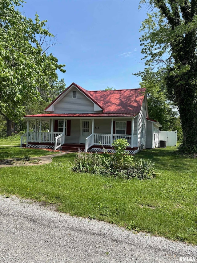 111 Bevard St, Carterville, IL 62918 - country-style home featuring covered porch and a front yard