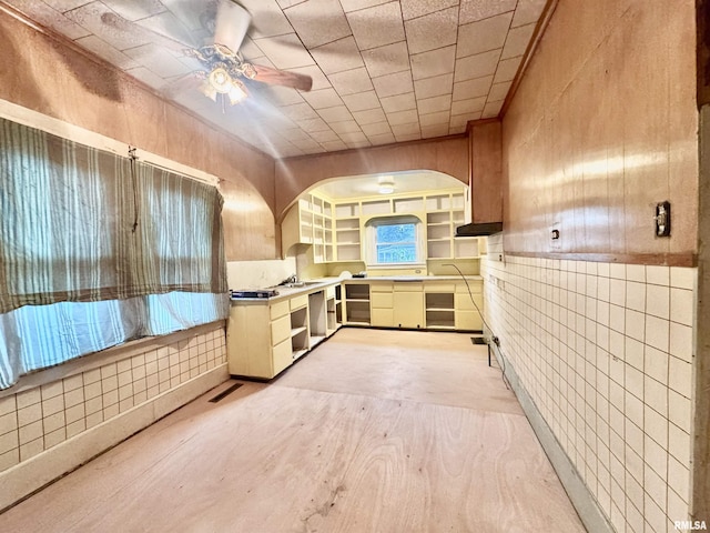 809 Highland St, Benton, IL 62812 - kitchen with a ceiling fan, light wood-style flooring, arched walkways, and premium range hood