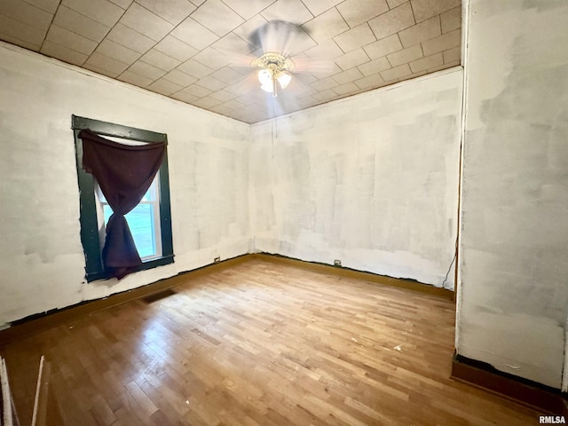 809 Highland St, Benton, IL 62812 - empty room with ceiling fan and wood finished floors