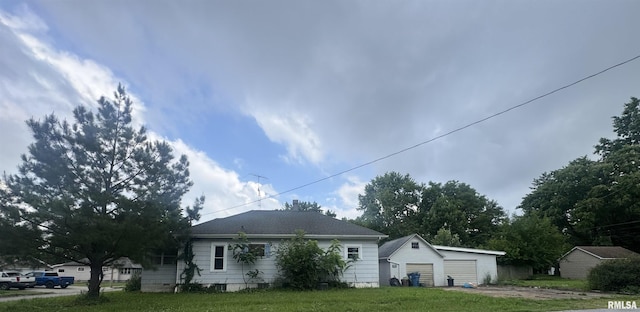 809 Highland St, Benton, IL 62812 - view of property exterior featuring a detached garage and an outbuilding