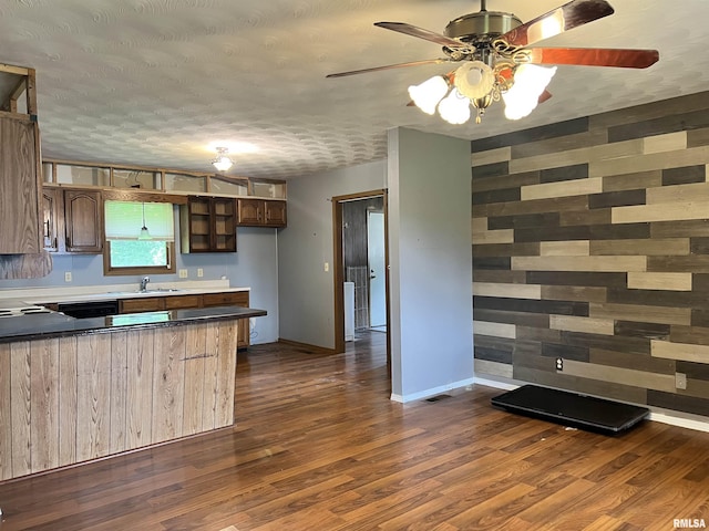 20 Suburban Dr, Murphysboro, IL 62966 - kitchen with ceiling fan, a peninsula, dark wood-type flooring, a textured ceiling, and dishwasher