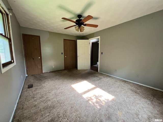 20 Suburban Dr, Murphysboro, IL 62966 - unfurnished bedroom featuring carpet flooring, two closets, and a ceiling fan
